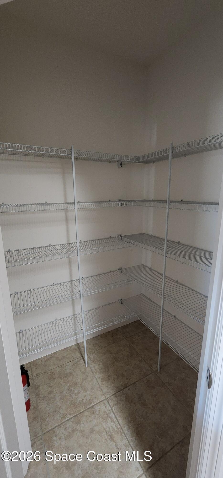 1957 Elkins Point Melbourne, FL 32935 - Photo 14 of 27 a view of a room with shelf