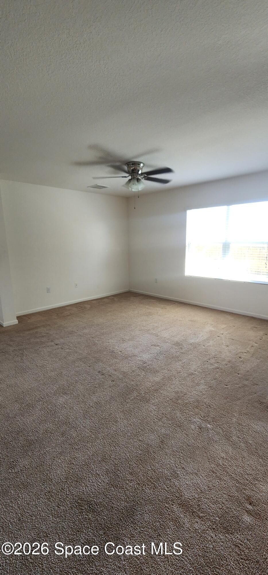 1957 Elkins Point Melbourne, FL 32935 - Photo 17 of 27 a view of a room with an empty space and a window