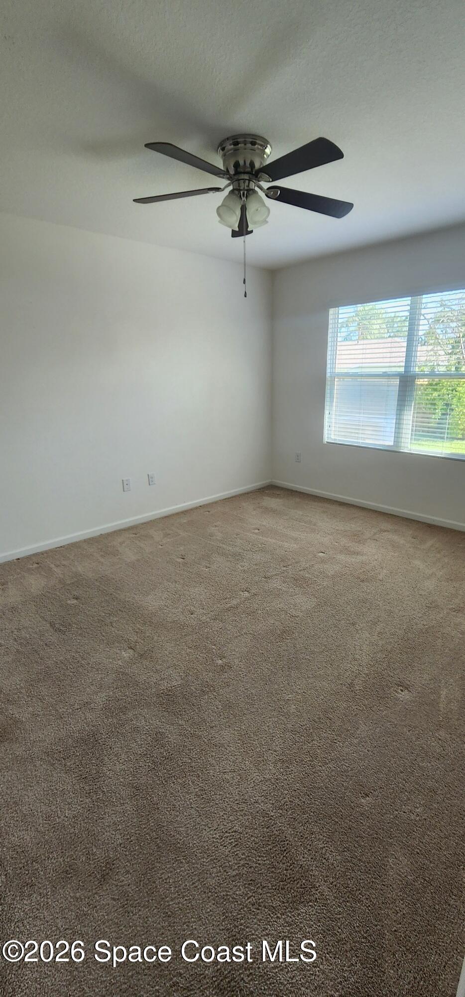 1957 Elkins Point Melbourne, FL 32935 - Photo 19 of 27 a view of an empty room with a window