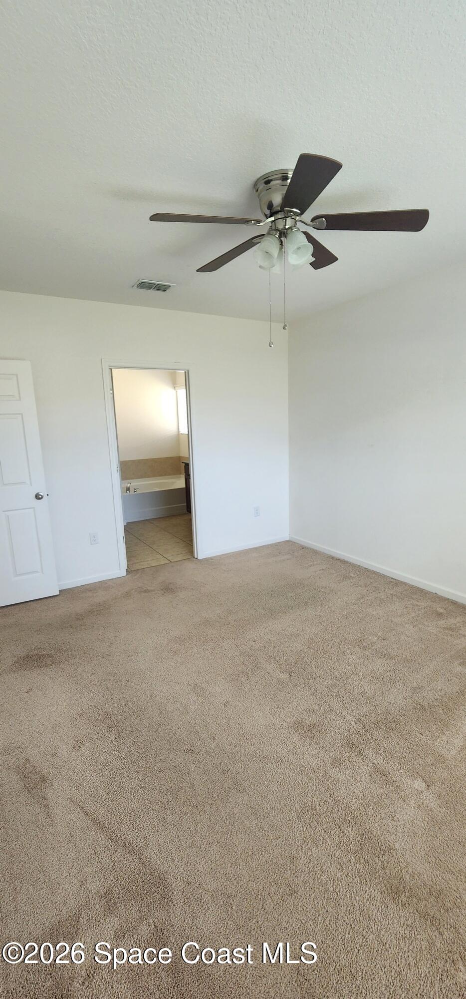 1957 Elkins Point Melbourne, FL 32935 - Photo 20 of 27 a view of a ceiling fan in a room