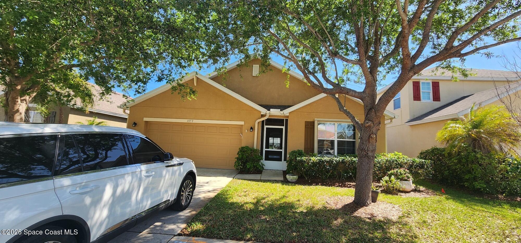 1957 Elkins Point Melbourne, FL 32935 - Photo 2 of 27 a house view with a outdoor space