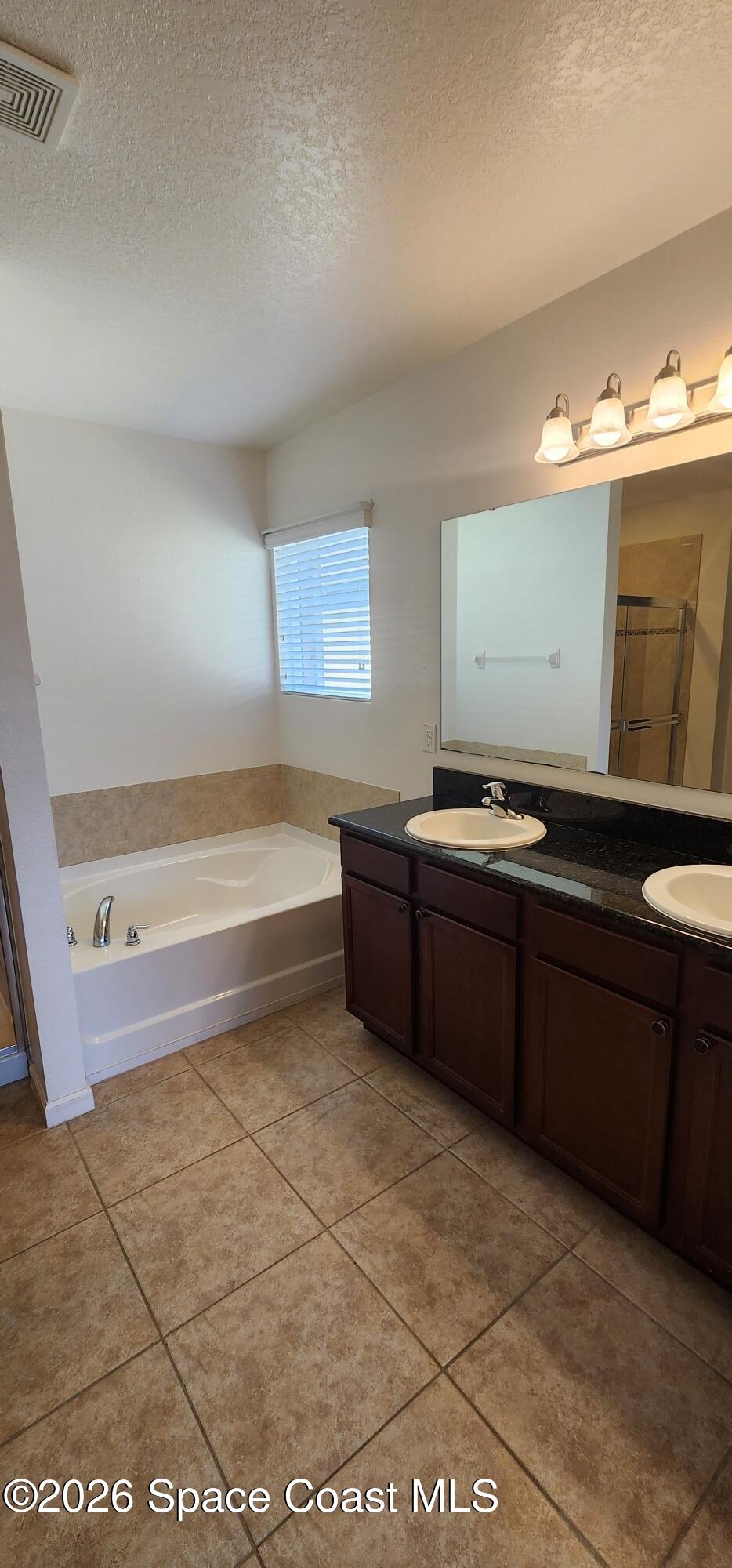 1957 Elkins Point Melbourne, FL 32935 - Photo 21 of 27 a kitchen with a sink and a stove