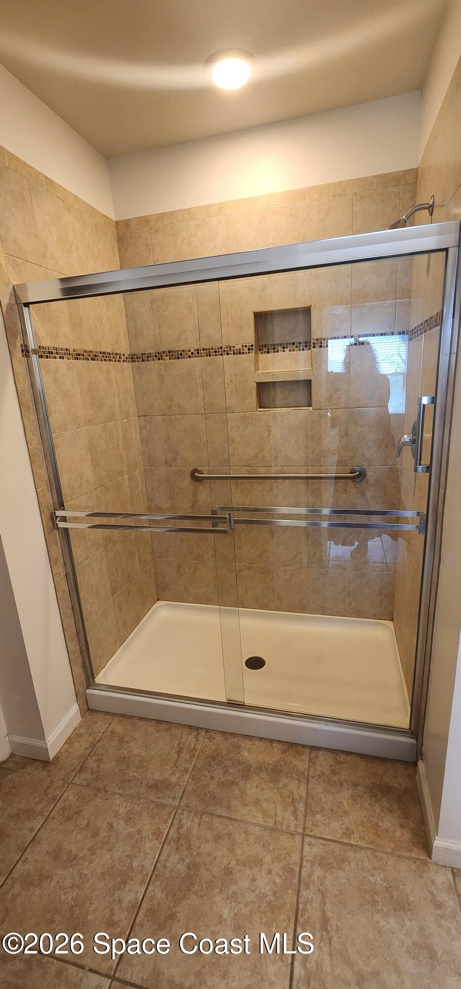 1957 Elkins Point Melbourne, FL 32935 - Photo 22 of 27 a bathroom with a shower