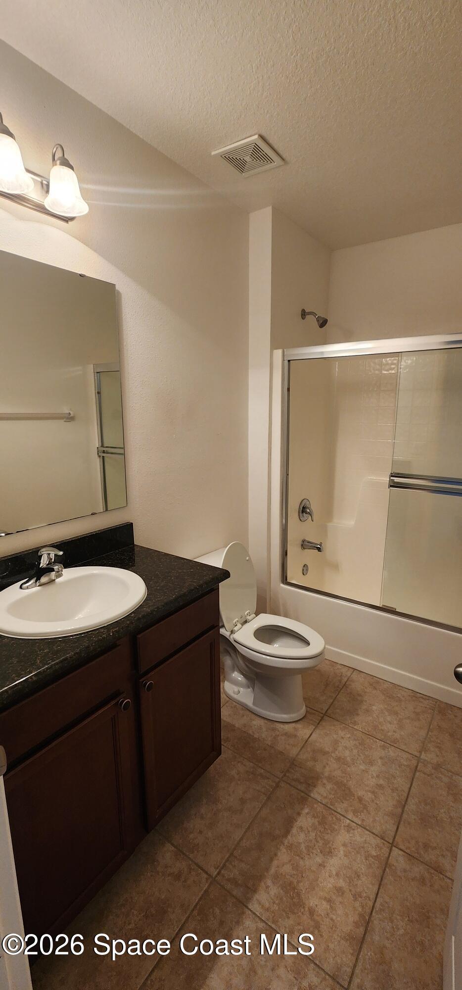 1957 Elkins Point Melbourne, FL 32935 - Photo 5 of 27 a bathroom with a sink a toilet and shower