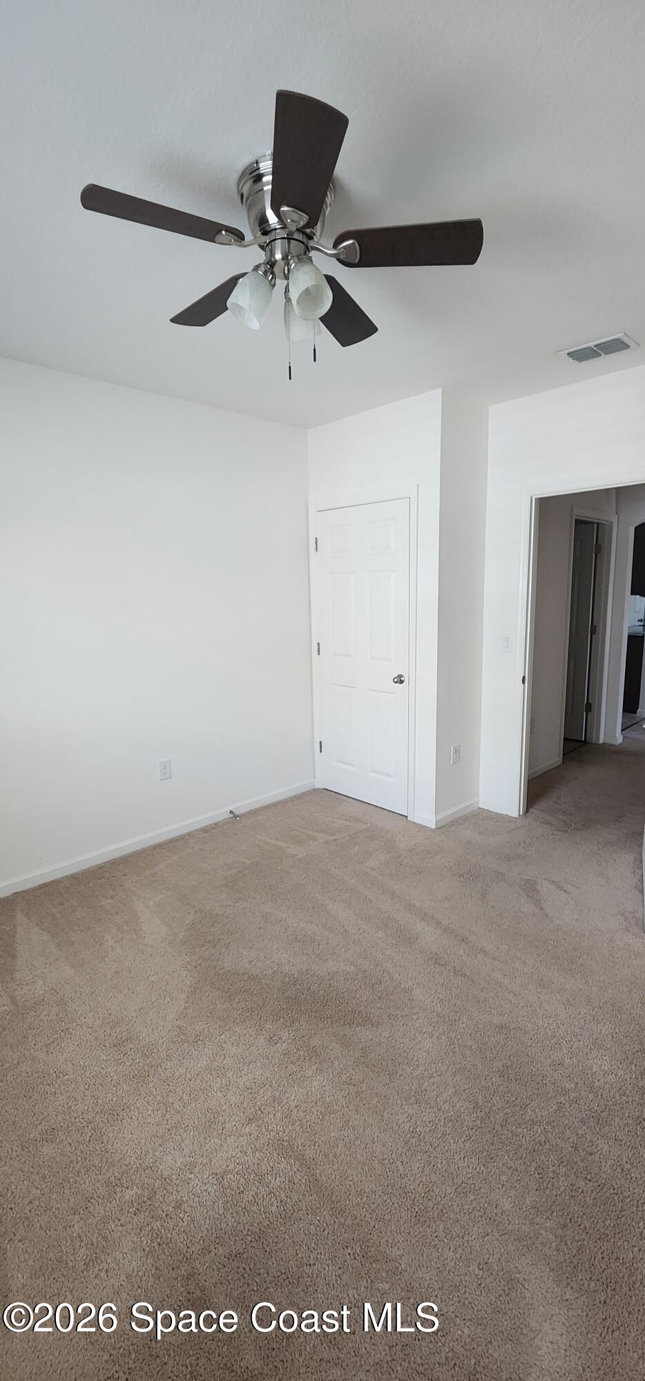 1957 Elkins Point Melbourne, FL 32935 - Photo 10 of 27 a view of a big room with a ceiling fan
