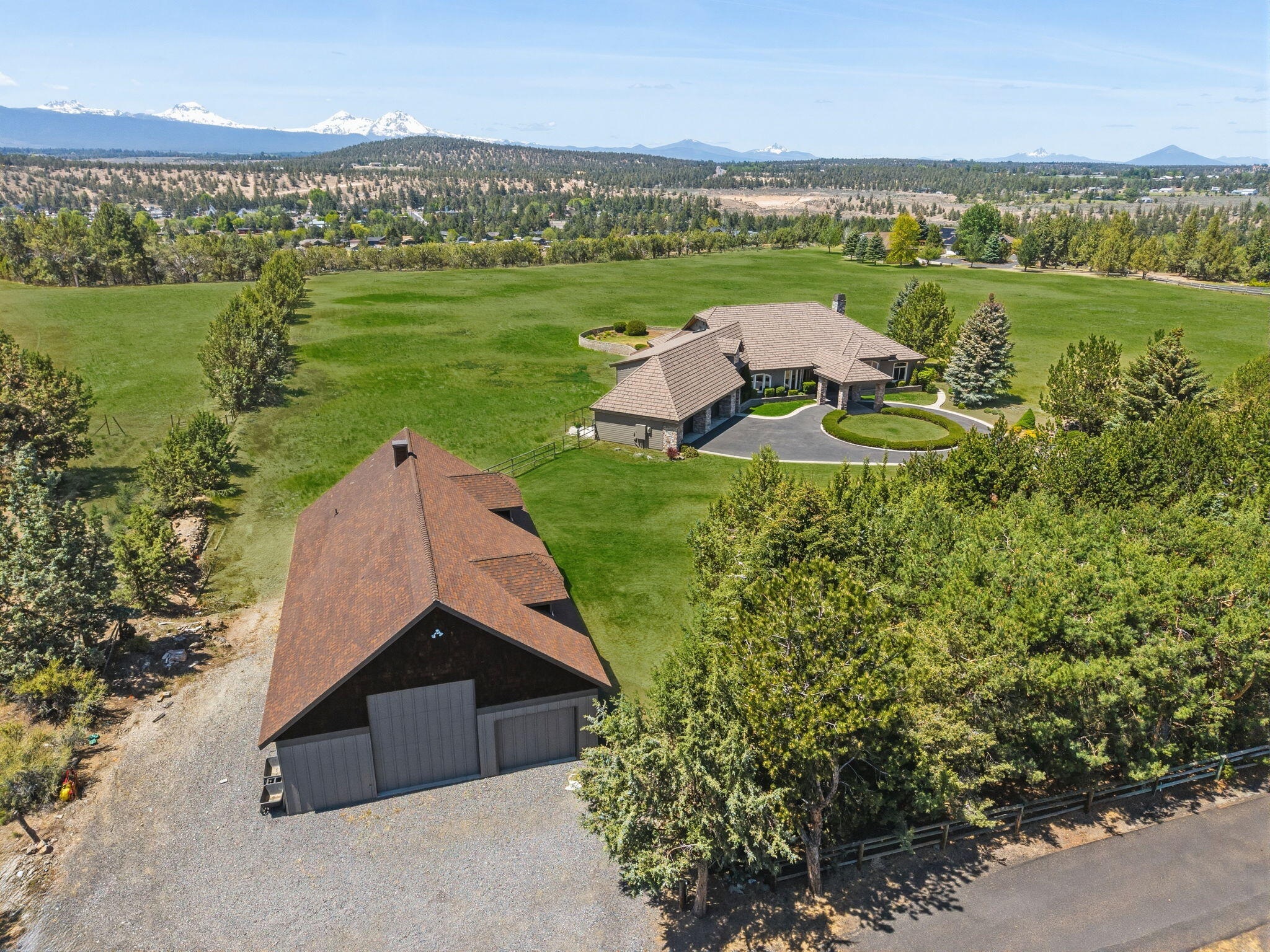 20180 Winston Loop Bend, OR 97703 - Photo 54 of 59 an aerial view of a house with a yard and lake view