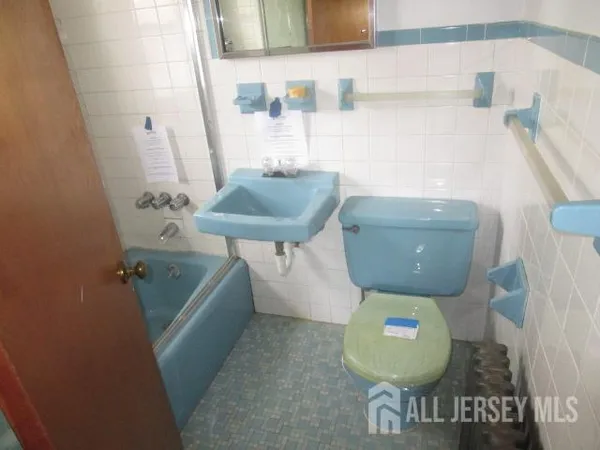 a bathroom with a sink and toilet