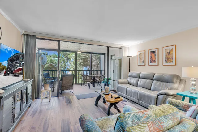 a balcony with furniture and a window