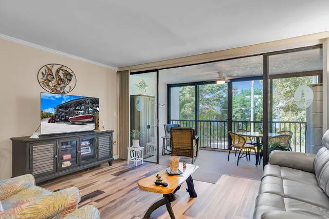 a view of a two chairs in the balcony