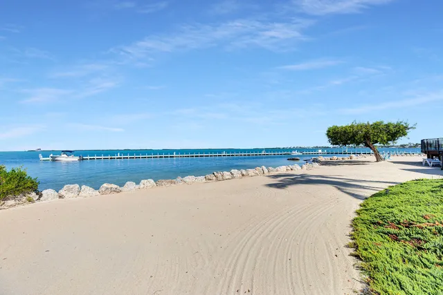 an aerial view of a houses with a yard