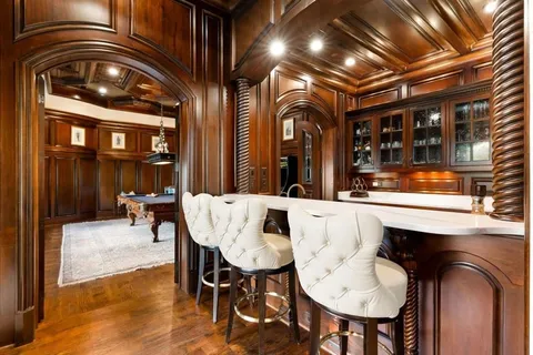 a living room with furniture and a piano