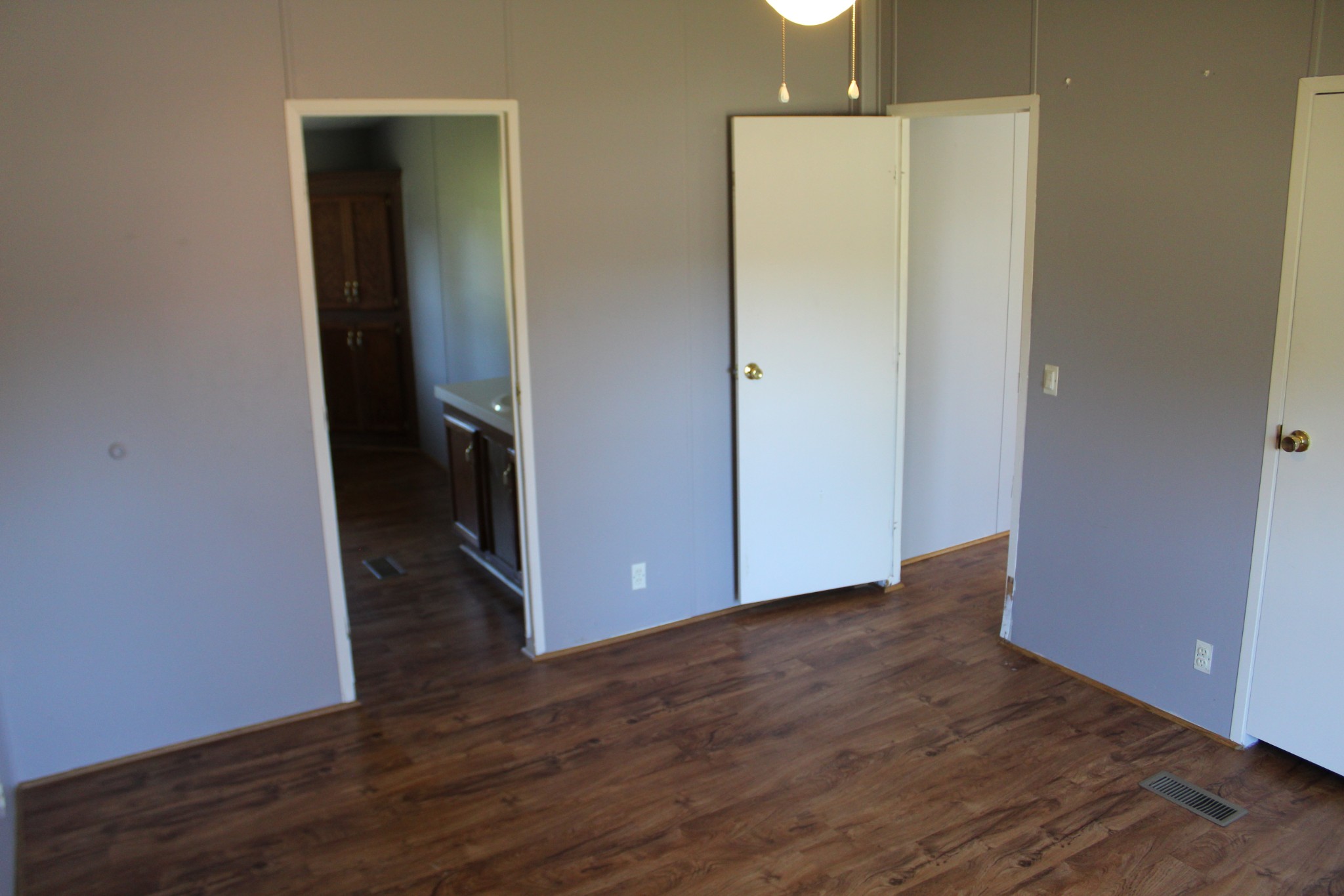 5453 Awalt Road Tullahoma, TN 37388 - Photo 12 of 19 a view of an empty room with wooden floor and a cabinet