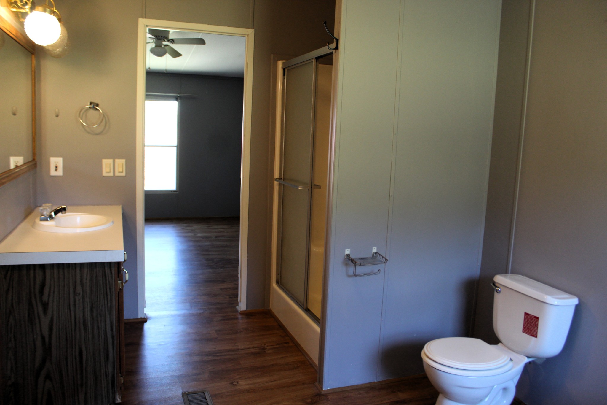 5453 Awalt Road Tullahoma, TN 37388 - Photo 14 of 19 a bathroom with a toilet a sink and mirror