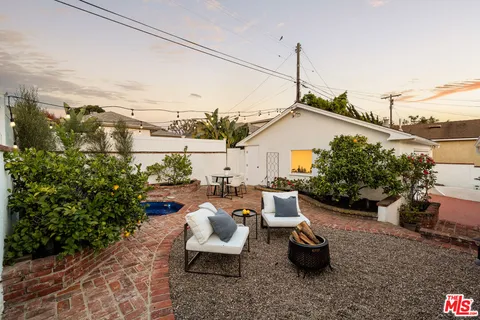 a view of a terrace with couches and potted plants