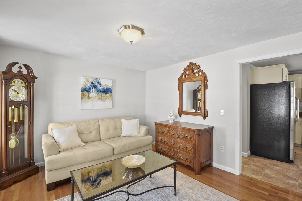 54 Carroll Hill Road Charlton, MA 01507 - Photo 13 of 30 a living room with furniture and wooden floor