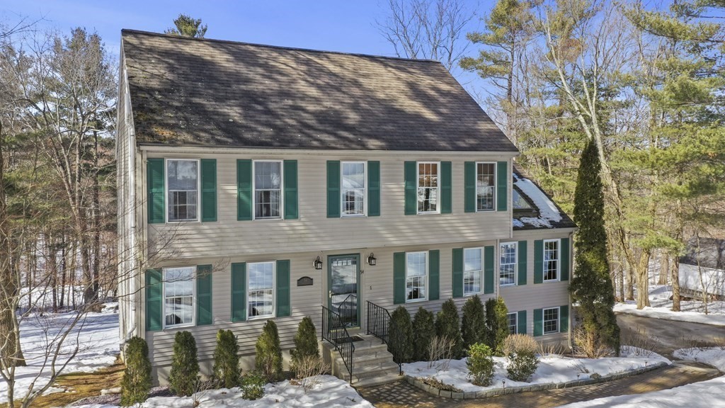 54 Carroll Hill Road Charlton, MA 01507 - Photo 27 of 30 a front view of a house with garden