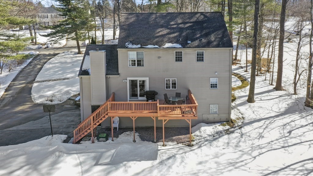 54 Carroll Hill Road Charlton, MA 01507 - Photo 29 of 30 a backyard of a house with barbeque oven table and chairs