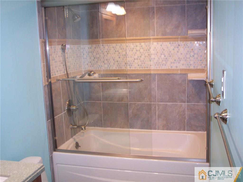 48 Lance Road Clark, NJ 07066 - Photo 13 of 25 a bathroom with a shower and bathtub