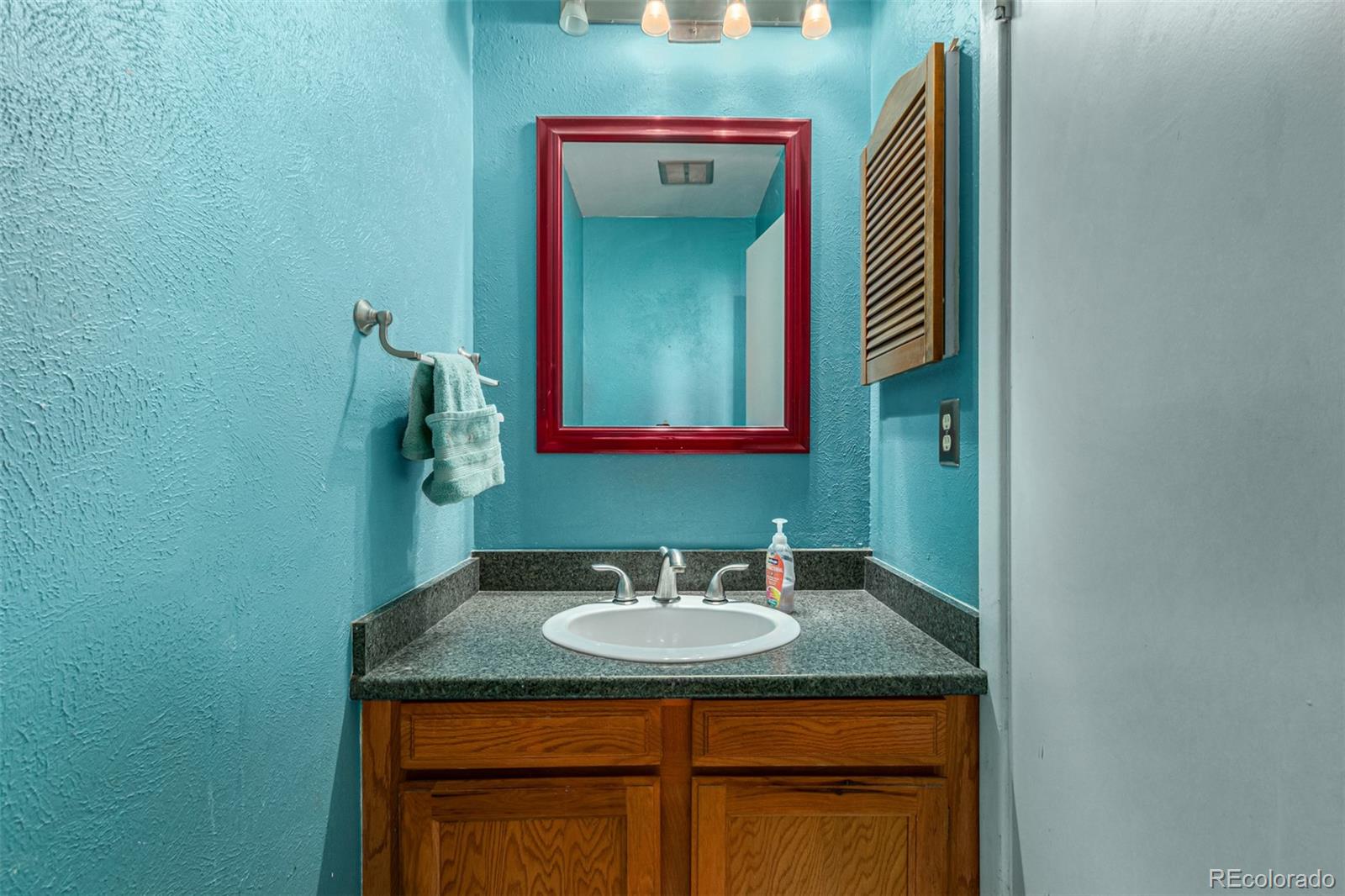 8140 West 90th Avenue Westminster, CO 80021 - Photo 17 of 47 a bathroom with a sink and a mirror