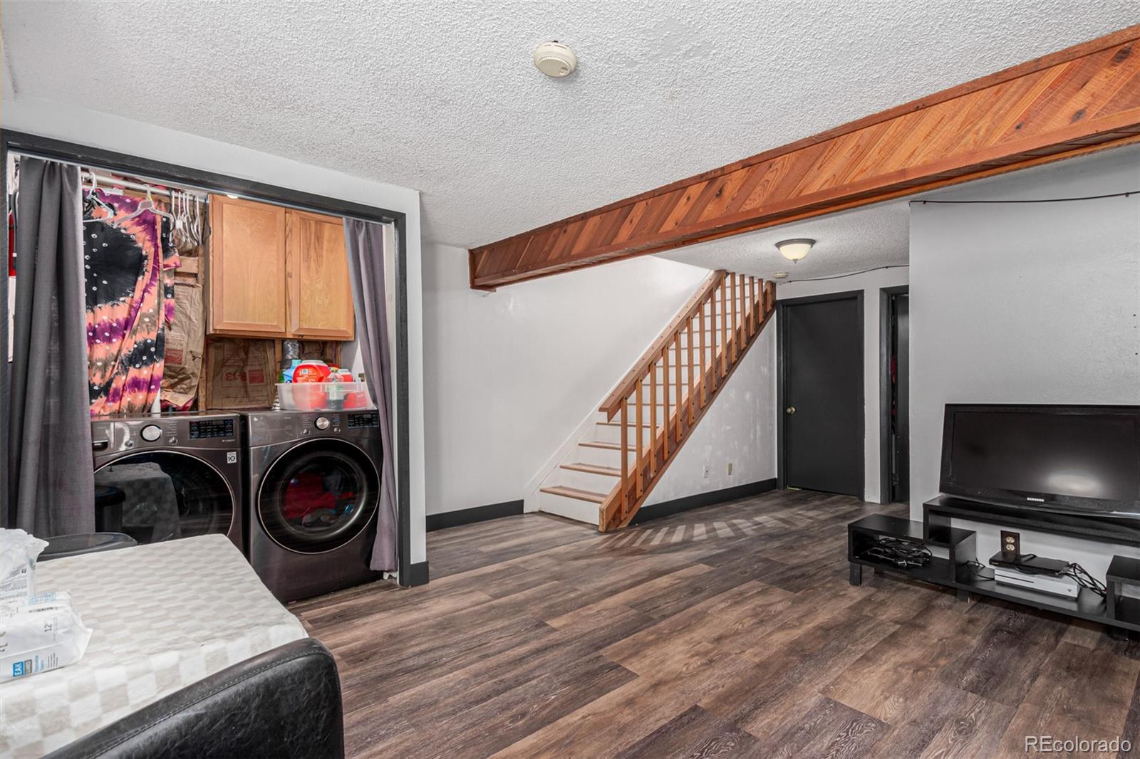 8140 West 90th Avenue Westminster, CO 80021 - Photo 30 of 47 a view of a bedroom with baby and a flat screen tv