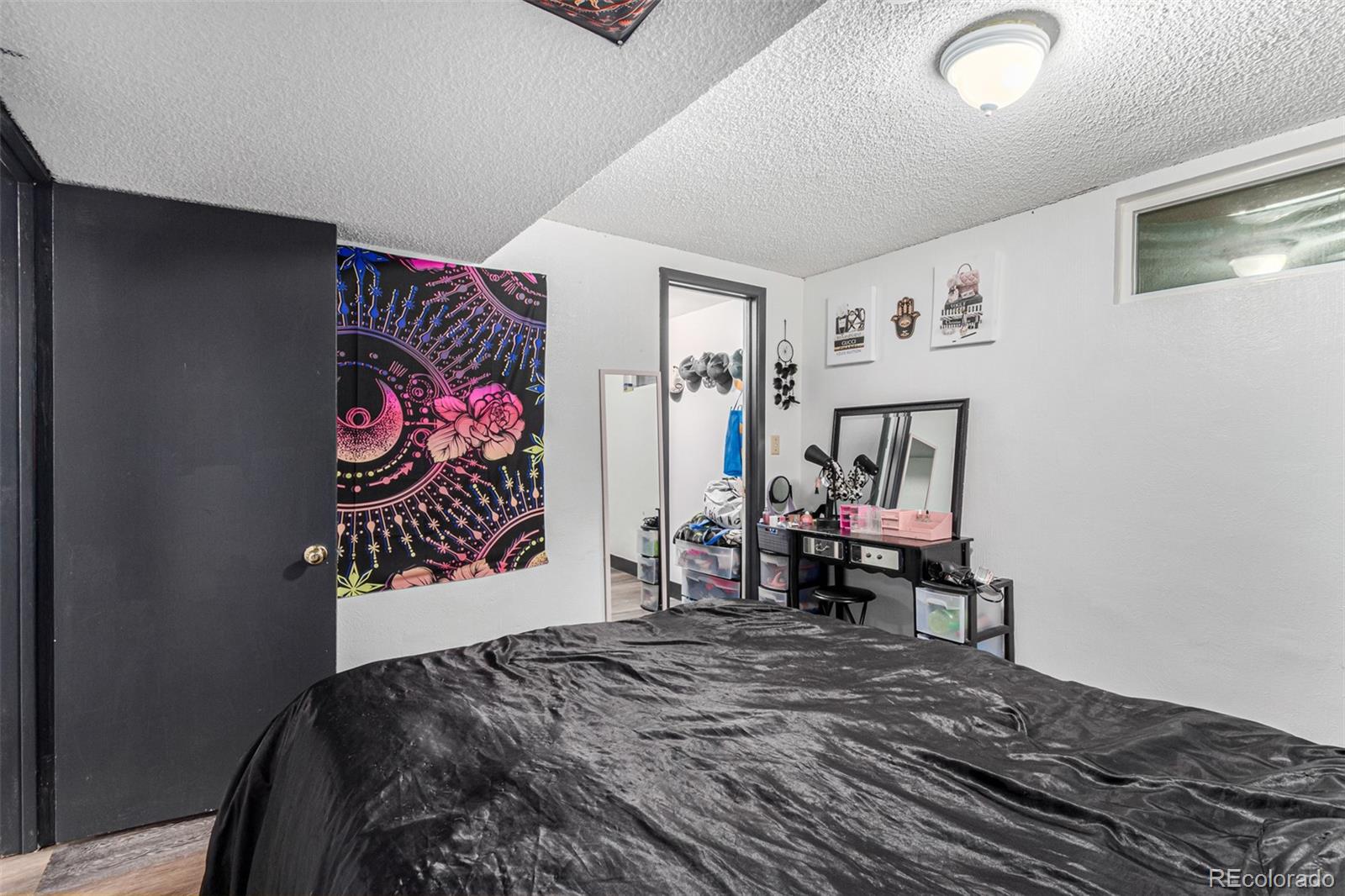 8140 West 90th Avenue Westminster, CO 80021 - Photo 37 of 47 a bed room with a bed and a chair