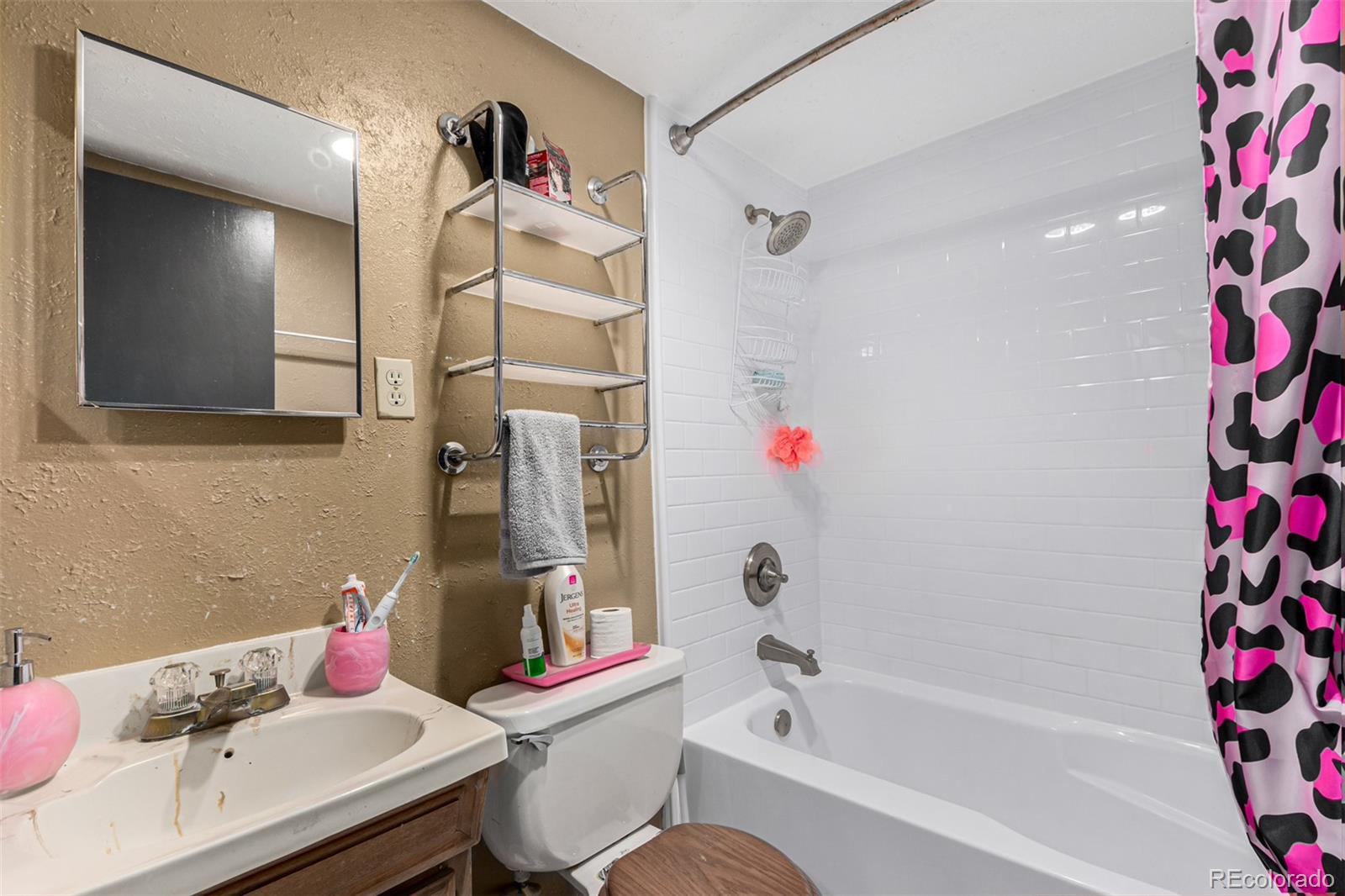 8140 West 90th Avenue Westminster, CO 80021 - Photo 39 of 47 a bathroom with a sink toilet and shower