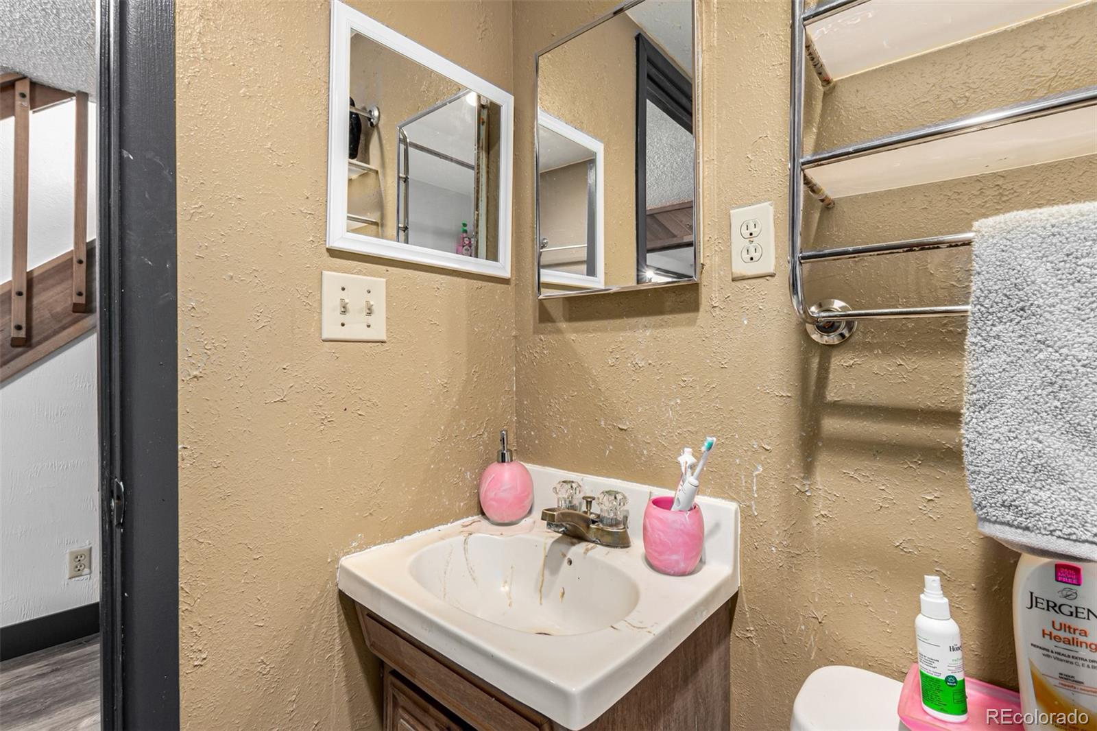 8140 West 90th Avenue Westminster, CO 80021 - Photo 40 of 47 a bathroom with a sink and a mirror