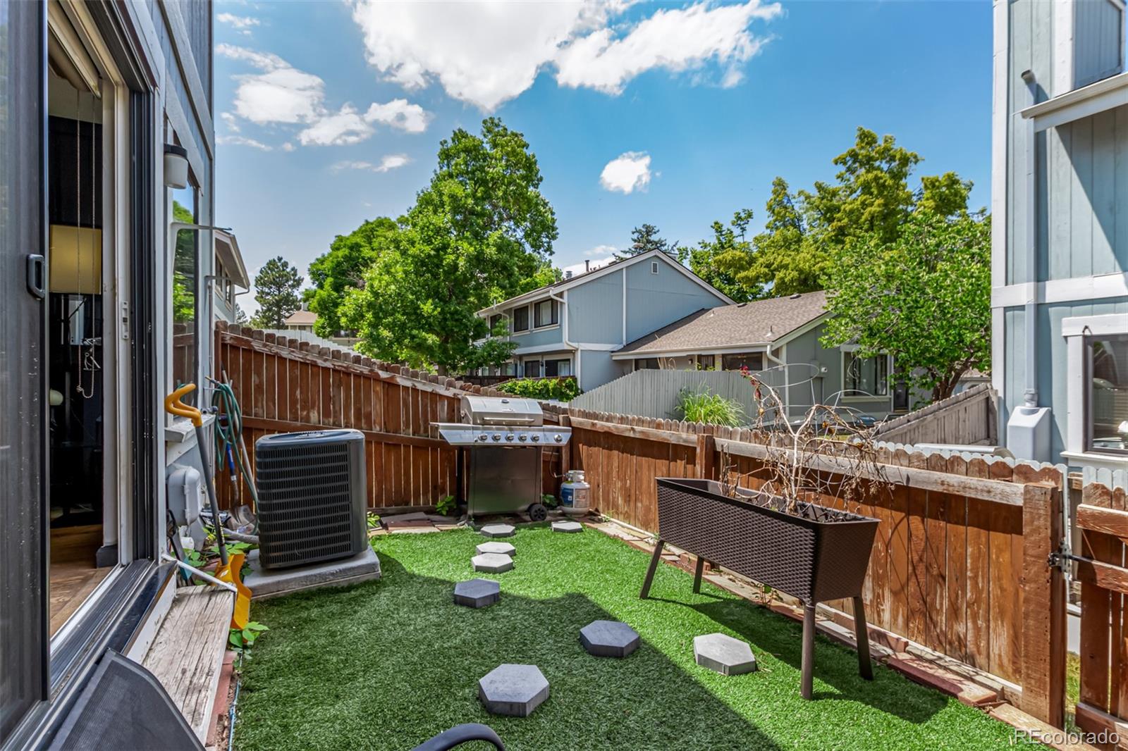 8140 West 90th Avenue Westminster, CO 80021 - Photo 41 of 47 a view of an house with backyard and furniture