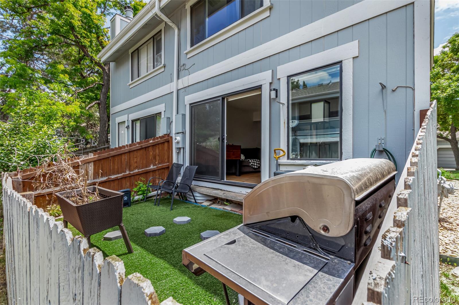 8140 West 90th Avenue Westminster, CO 80021 - Photo 42 of 47 a front view of a house with garden