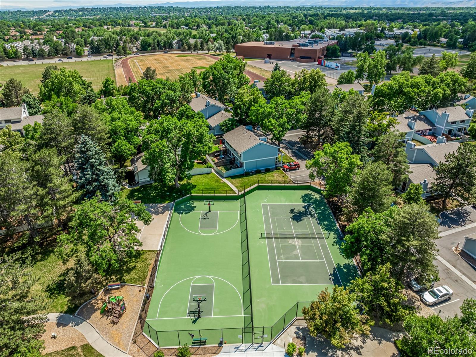 8140 West 90th Avenue Westminster, CO 80021 - Photo 45 of 47 an aerial view of a house with a yard and lake view