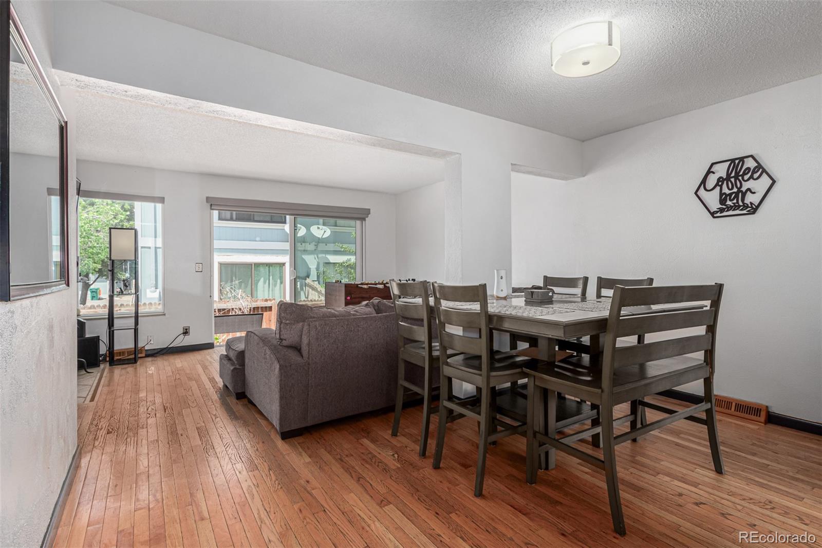 8140 West 90th Avenue Westminster, CO 80021 - Photo 10 of 47 a living room with furniture and a wooden floor