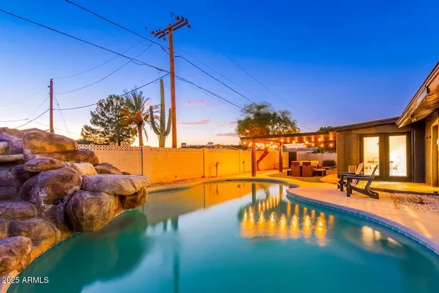 a view of a swimming pool with a patio