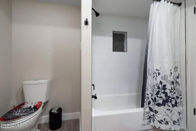 a bathroom with a bathtub and shower