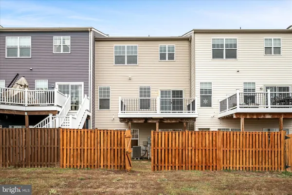a view of a house with wooden deck