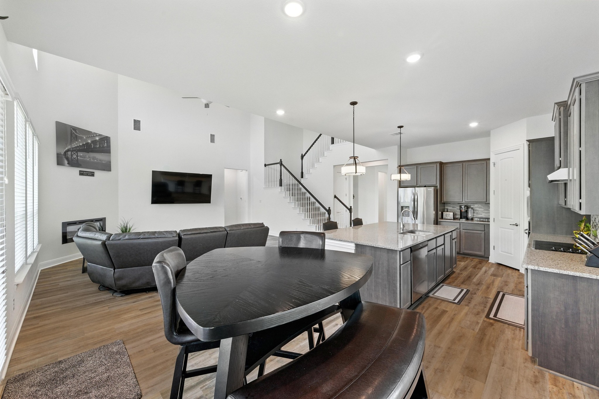 216 Tovas Secret Cove Georgetown, TX 78628 - Photo 11 of 39 Dining space featuring stairs, light wood finished floors, and recessed lighting