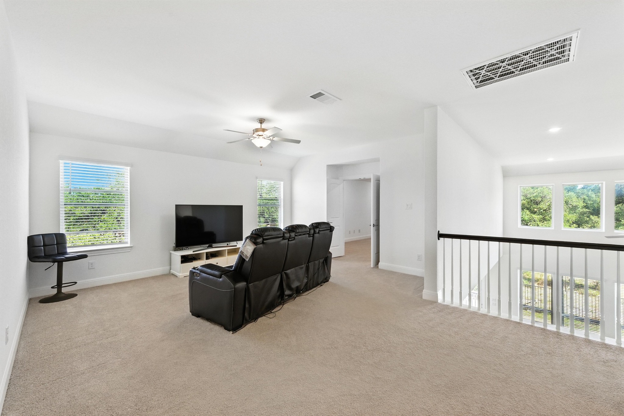 216 Tovas Secret Cove Georgetown, TX 78628 - Photo 14 of 30 a living room with furniture and a flat screen tv