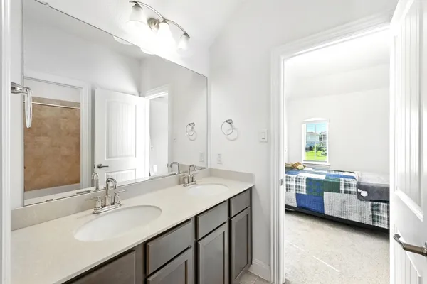 a view of bathroom with dual sinks