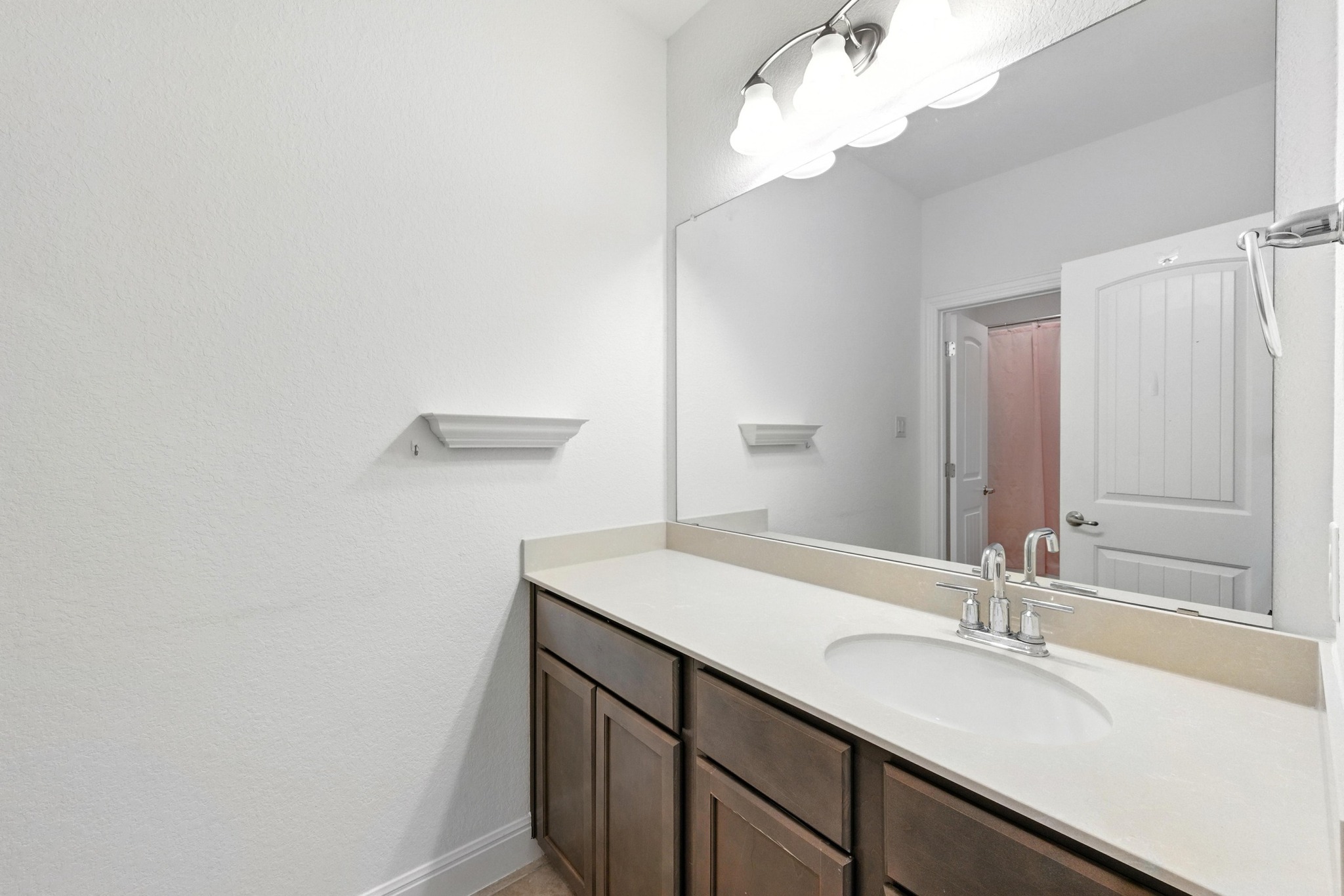216 Tovas Secret Cove Georgetown, TX 78628 - Photo 20 of 30 a bathroom with a sink and a mirror