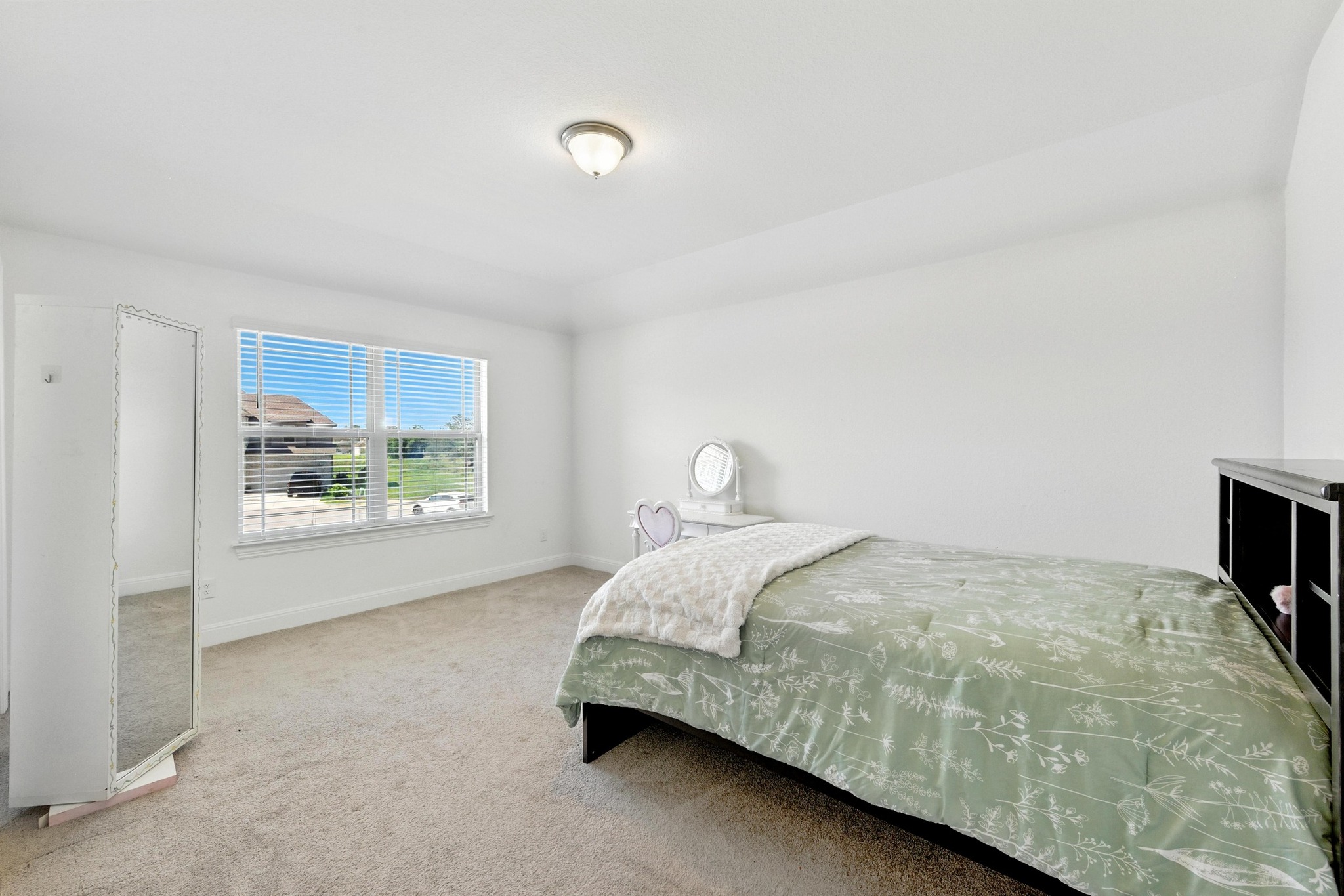 216 Tovas Secret Cove Georgetown, TX 78628 - Photo 22 of 30 a bedroom with a bed and a window