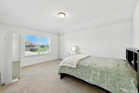 a view of a living room with furniture and a flat screen tv