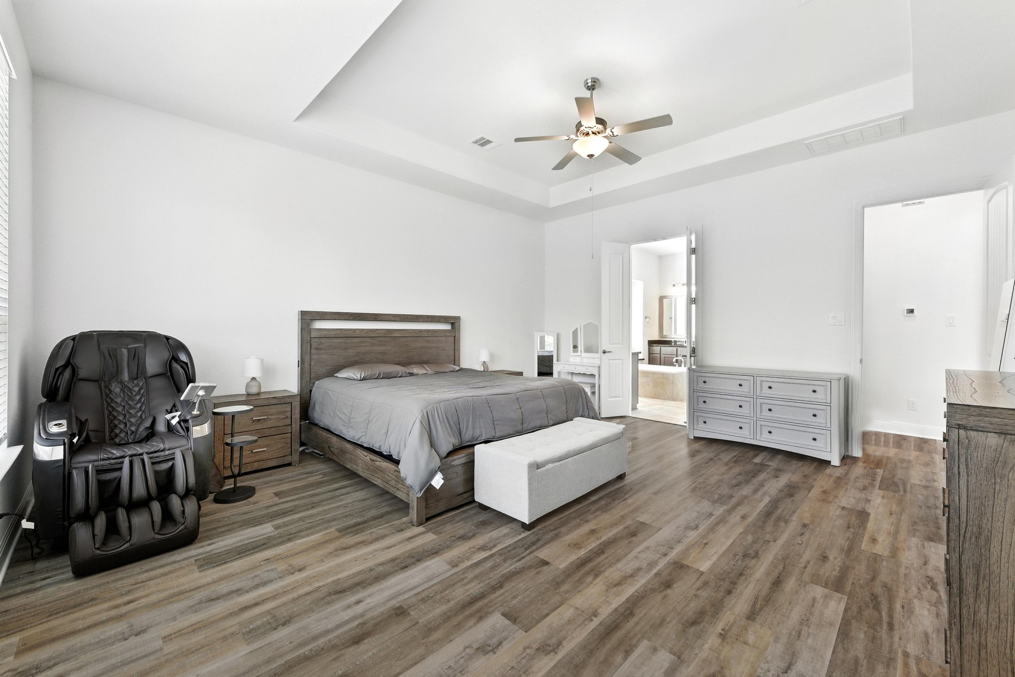 216 Tovas Secret Cove Georgetown, TX 78628 - Photo 9 of 30 a bedroom with a bed and wooden floor