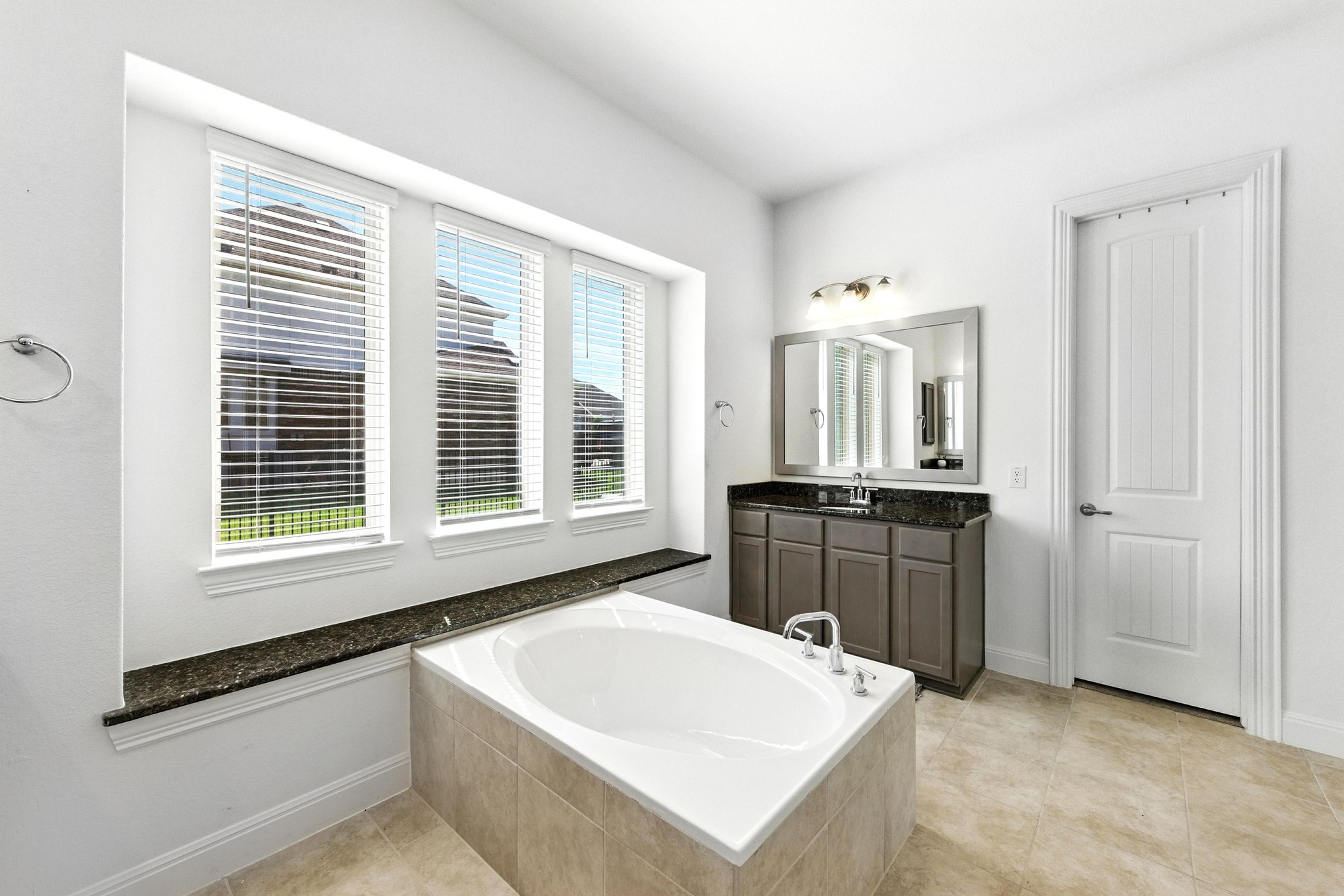 216 Tovas Secret Cove Georgetown, TX 78628 - Photo 10 of 30 a large white kitchen with a large window