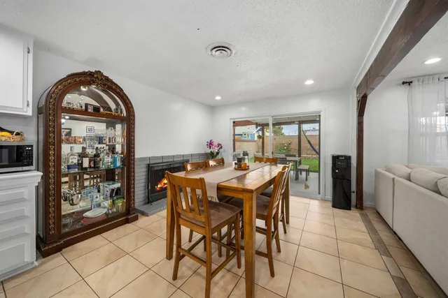 a dining room with furniture and window