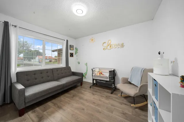 a living room with furniture and a large window