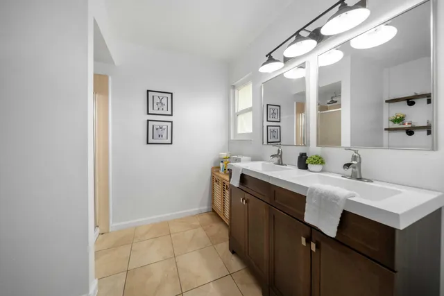 a kitchen with a sink and a refrigerator