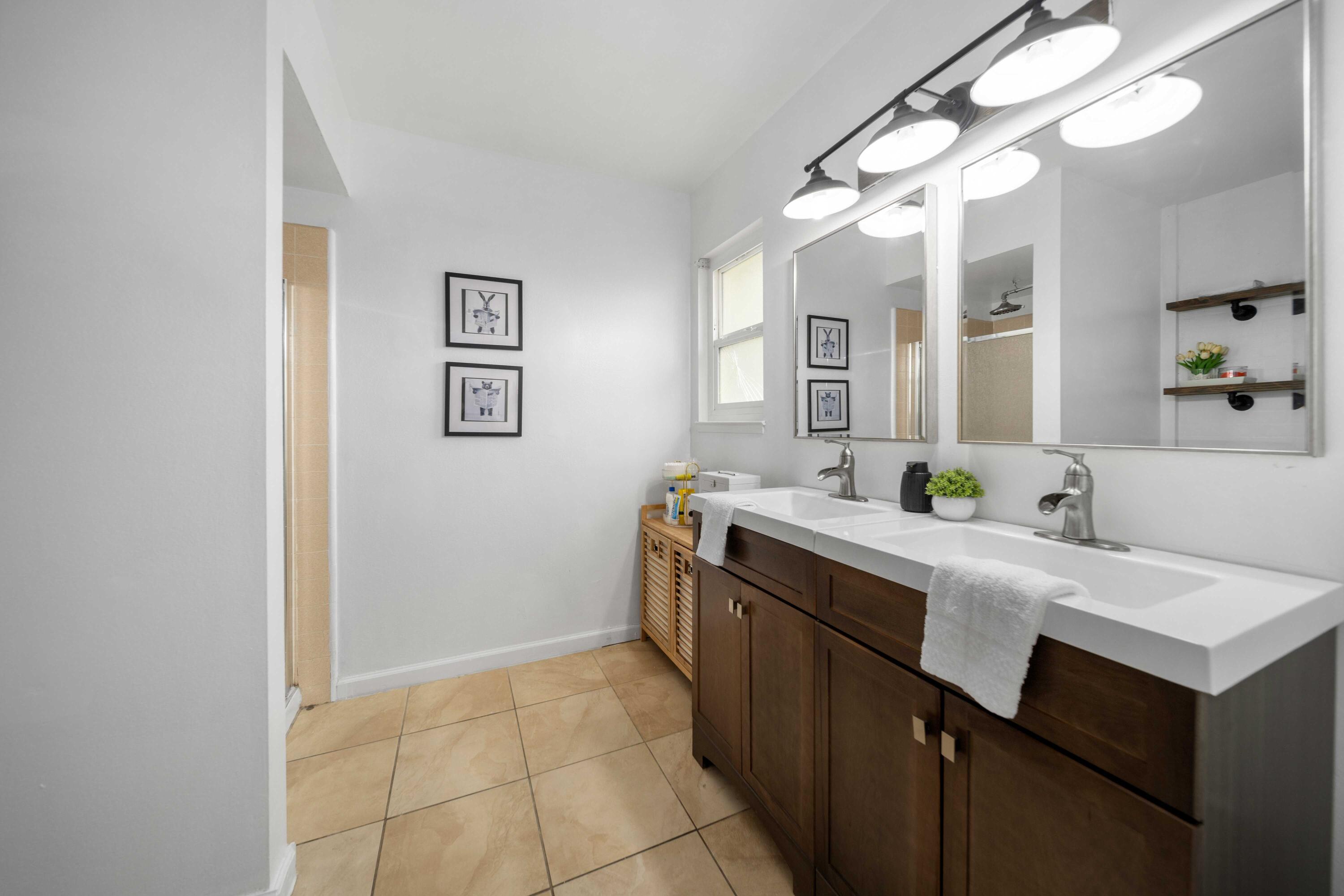 45339 Saigon Avenue Lancaster, CA 93534 - Photo 22 of 28 a kitchen with a sink and a refrigerator