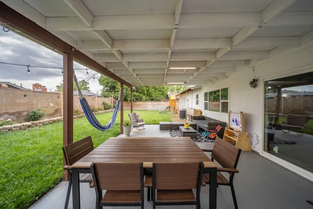 a view of a dining room with furniture window and outside view