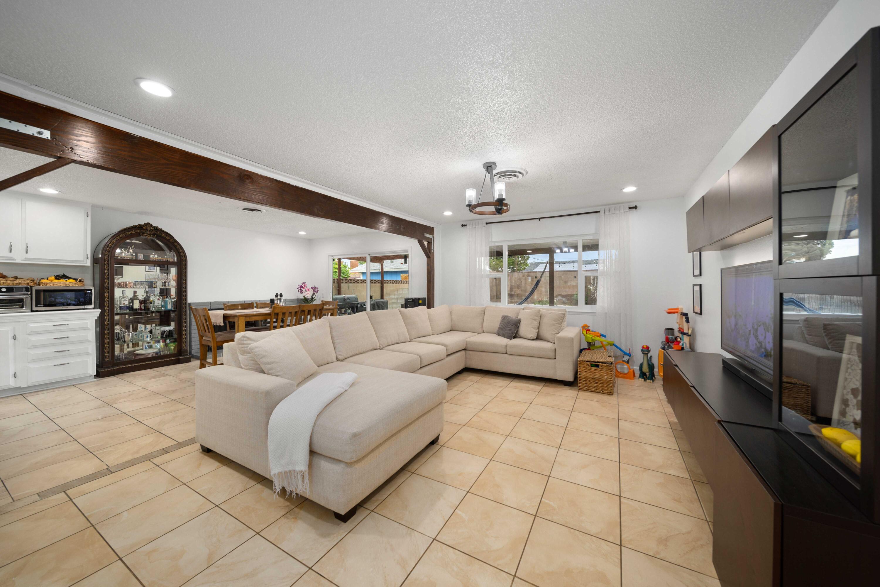 45339 Saigon Avenue Lancaster, CA 93534 - Photo 4 of 28 a living room with furniture and a flat screen tv