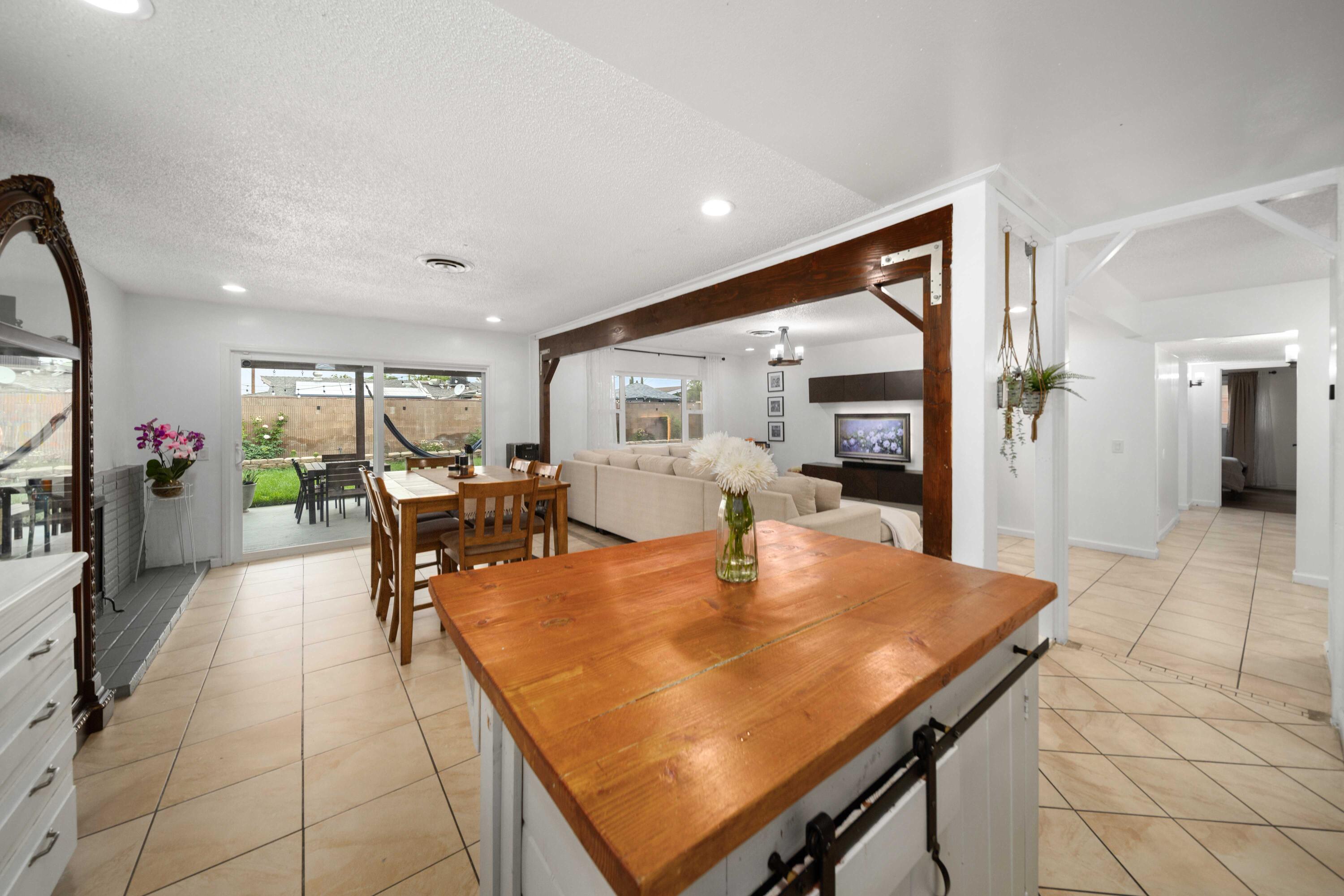 45339 Saigon Avenue Lancaster, CA 93534 - Photo 10 of 28 a dining room with furniture and a large window
