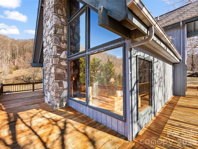 a view of a pathway of a house with wooden floor
